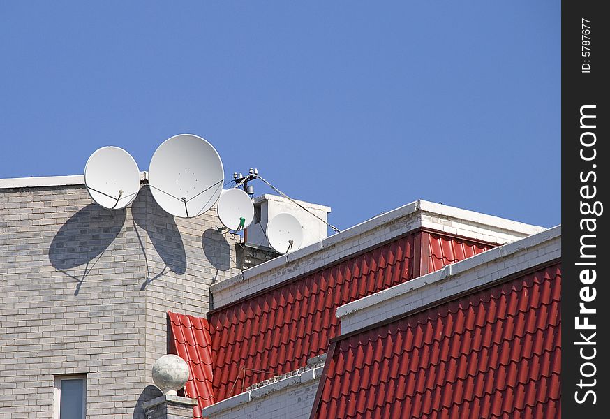 Satellite aerials on a roof of the house