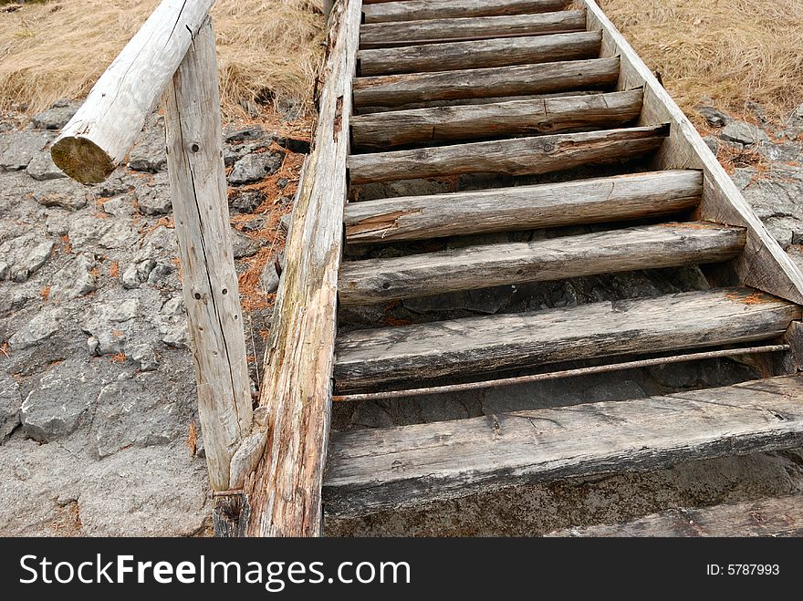 Old wooden stairs on the lake bank