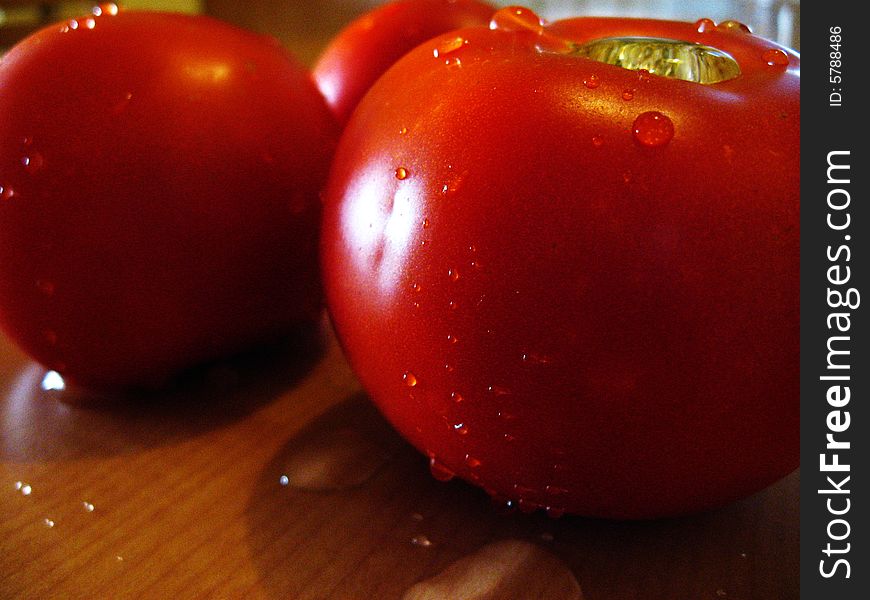 Big fresh tomatoes on table