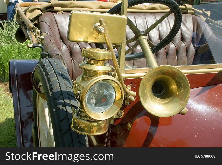 Detail of vintage car with lamp and horn