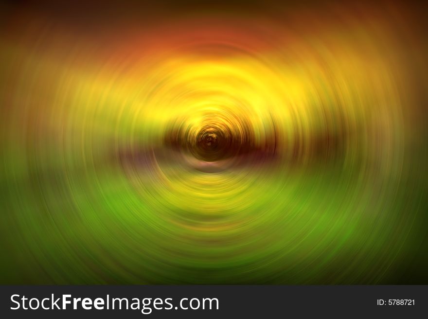 Colorful background with red, green, yellow, and orange swirled in a circular shape.