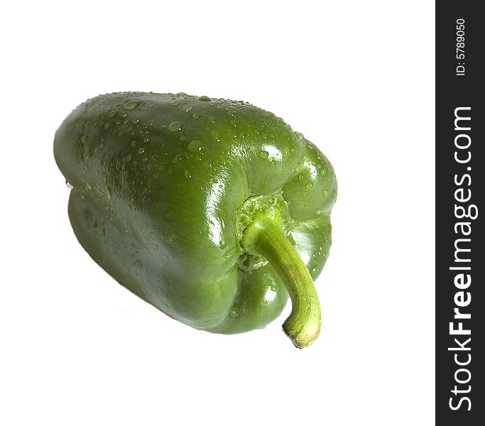 Green wet bell pepper isolated on white