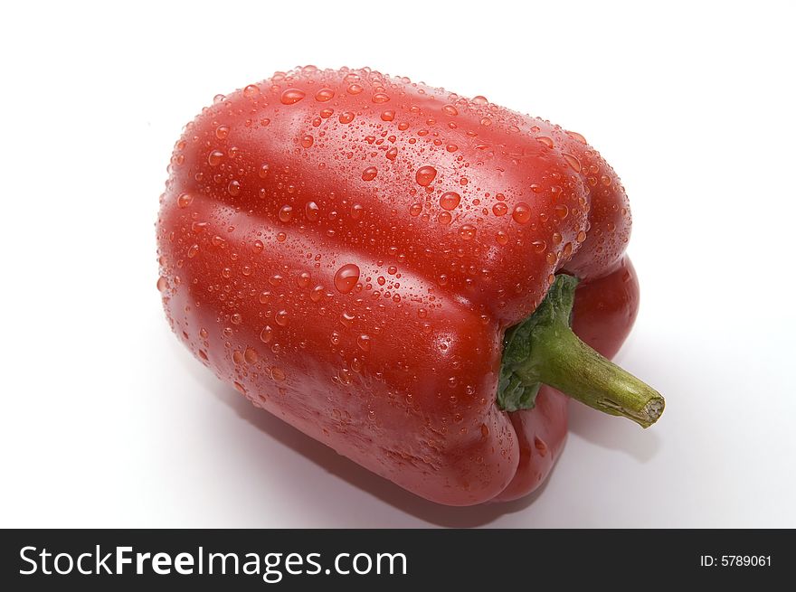 Wet red bell pepper isolated on white