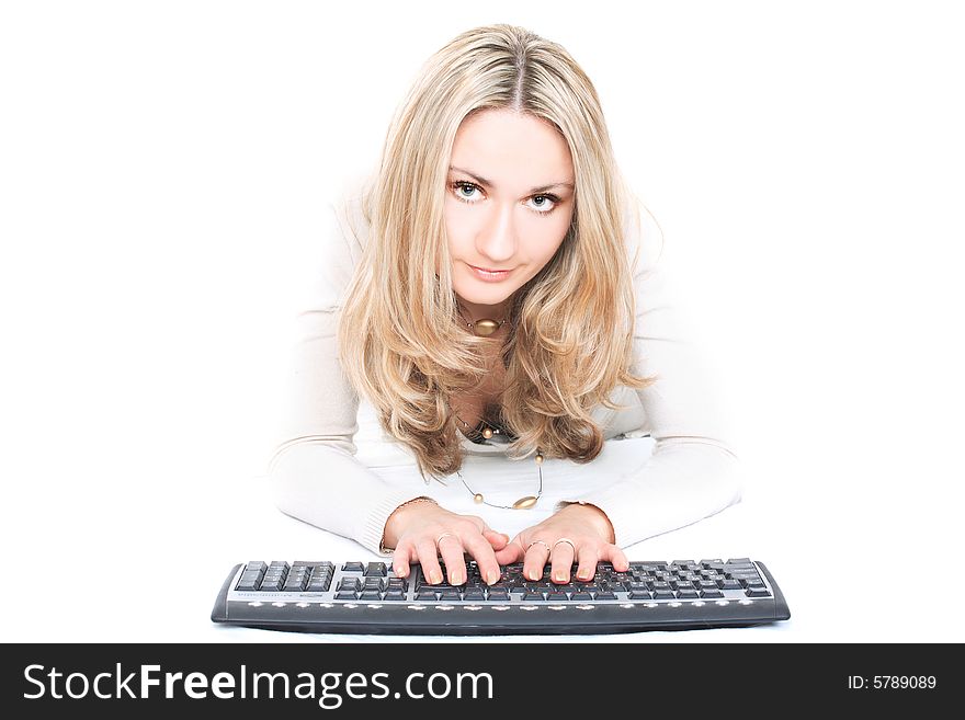 Portrait of a cute blonde with keyboard isolated on white