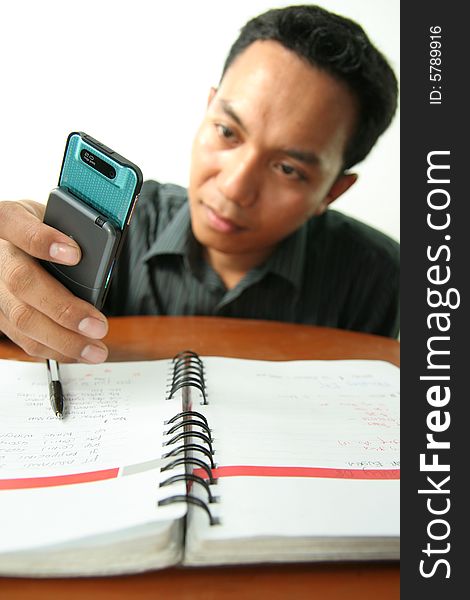 Man with homework difficulty and use mobile phone for help