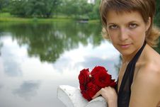 Attractive Young Woman With Red Flowers Stock Photo Attractive Young Woman With Red Flowers Stock Photo