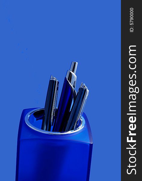 Executive Pens in a Blue container on a blue background. Executive Pens in a Blue container on a blue background