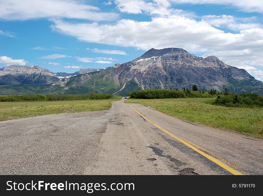 The 8-km scenic drive to the entrance of waterton lake national park, alberta, canada. The 8-km scenic drive to the entrance of waterton lake national park, alberta, canada