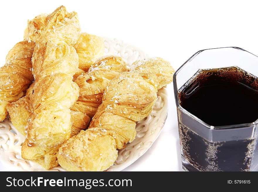 Fresh Puff Rolls On A Plate And A Cool Drink