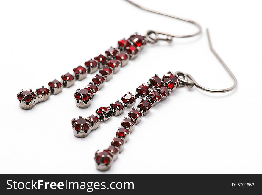 A pair of earrings, crimson stone gems