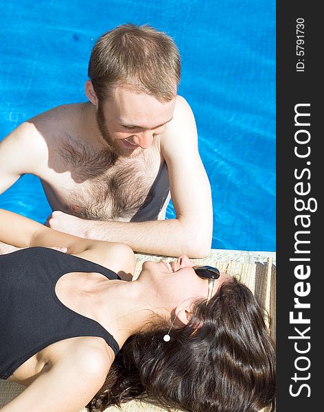 Couple in and Beside Pool - vertical