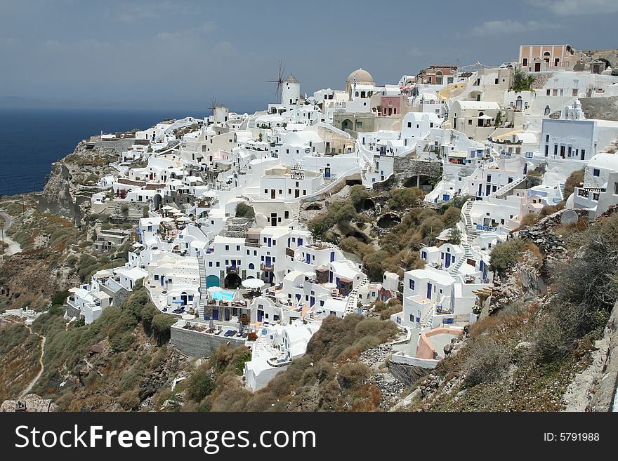 Coastal Greek village on the edge of a cliff. Coastal Greek village on the edge of a cliff.