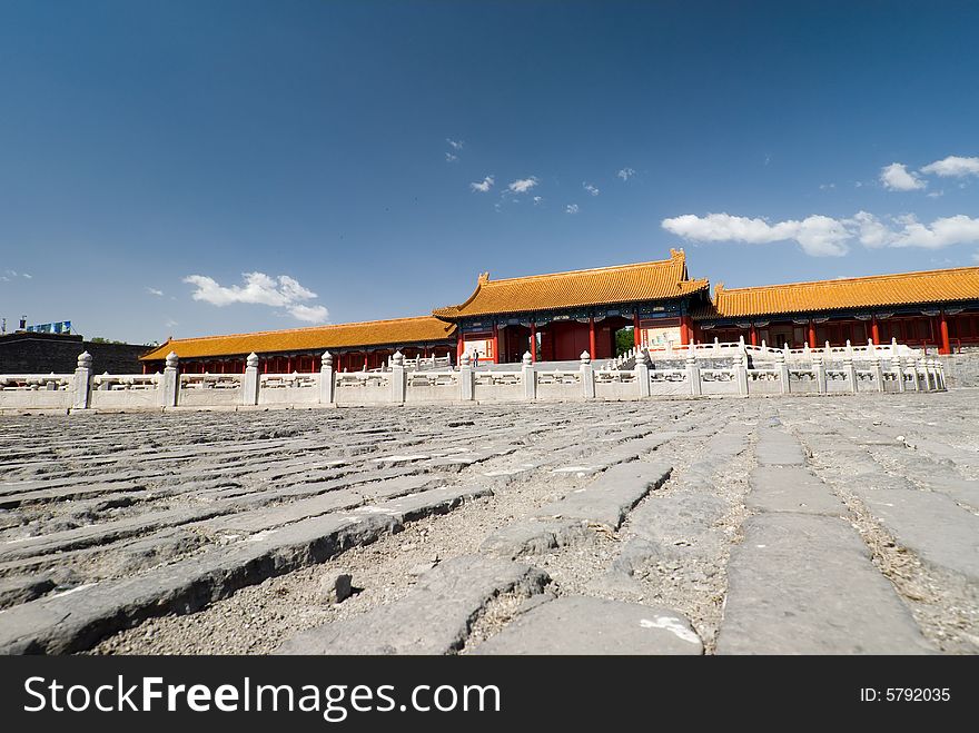 Wide angle view of buildings of the Emperor's palace in the forbidden city, Beijing, China. Sunny day and dark blue sky.