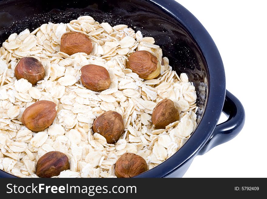 A bowl of oatmeal with hazelnuts - healthy diet