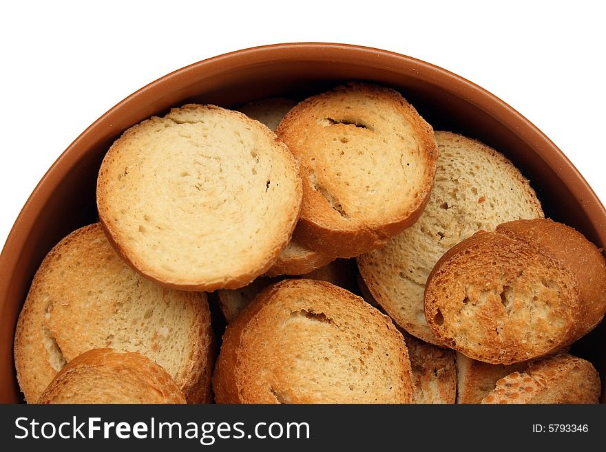 Crackers in brown bowl isolated on white