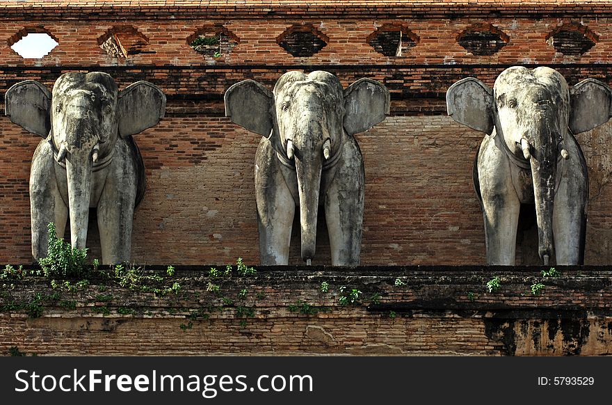 Thailand, Chiang Mai: Chedi Luang  is one of the oldest buddhist temples in the city. Architectural detail with elephants. Thailand, Chiang Mai: Chedi Luang  is one of the oldest buddhist temples in the city. Architectural detail with elephants