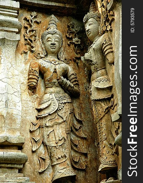 Thailand, Chiang Mai: Chedi Luang  is one of the oldest buddhist temples in the city. Architectural detail with carved figures. Thailand, Chiang Mai: Chedi Luang  is one of the oldest buddhist temples in the city. Architectural detail with carved figures