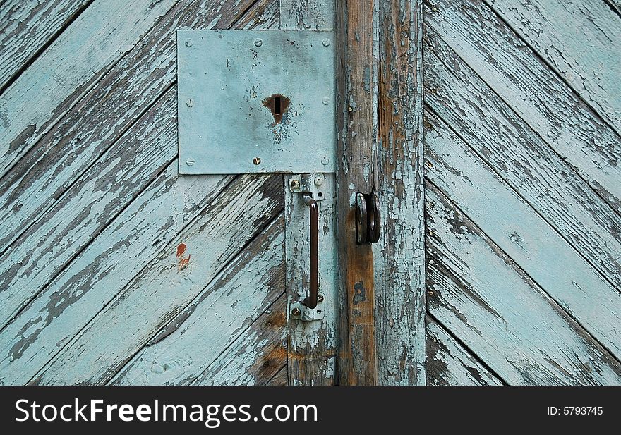 Old wooden door with a key lock. Old wooden door with a key lock