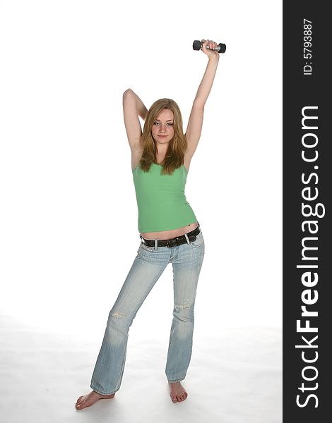 Woman lifting barbell over head
