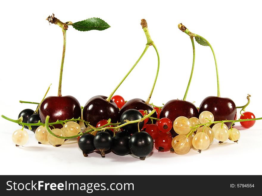 Collage of fruits and berries (horizontal row: cherry, currant, bilberry)