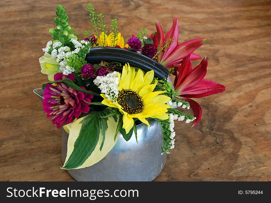 Retro tea kettle filled with summer flowers. Retro tea kettle filled with summer flowers.