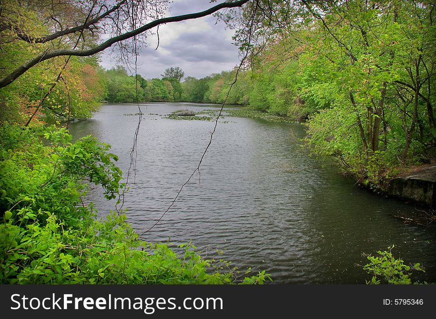 View of local reservoir on a cloudy spring day. View of local reservoir on a cloudy spring day