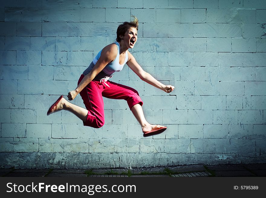 Young girl jumping and screaming. Young girl jumping and screaming.