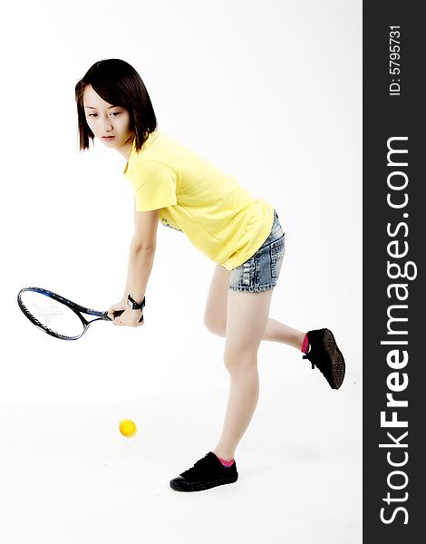A Chinese girl playing tennis. A Chinese girl playing tennis.