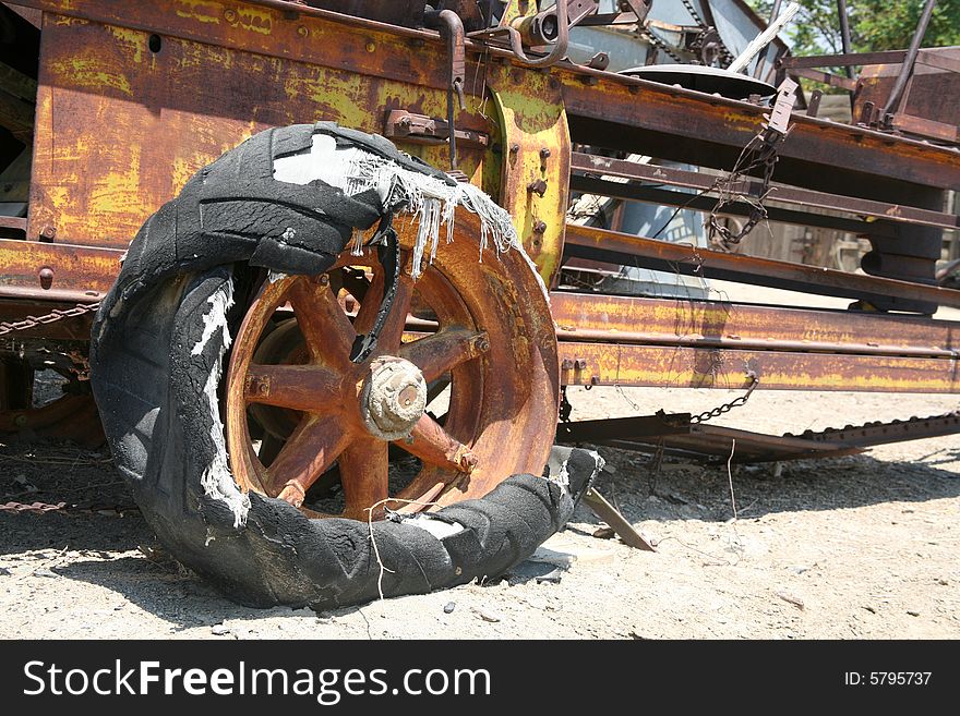 Old-fashioned broken and rust industrial farming equipment