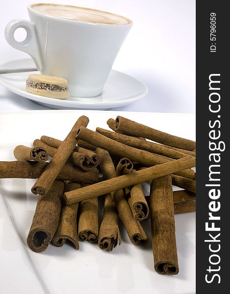 Coffee Cup And Cinnamon Sticks