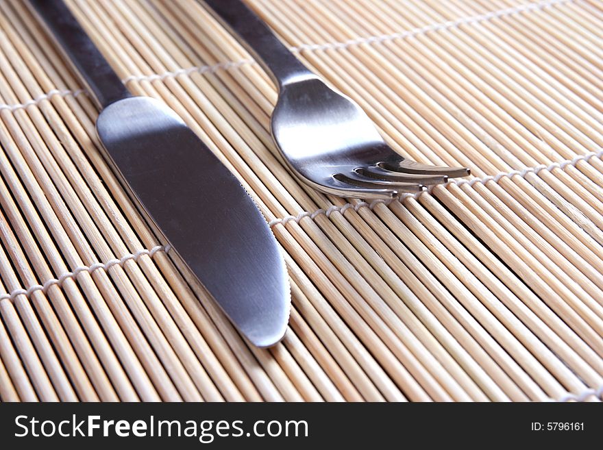 Fork An Knife On Bamboo  Mat