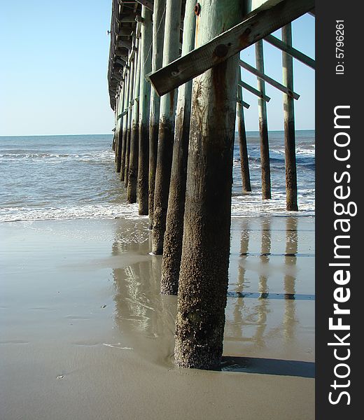 Underneath pier looking out to the ocean. Underneath pier looking out to the ocean