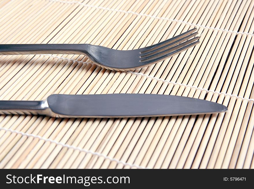 Knife And Fork On Kitchen Mat