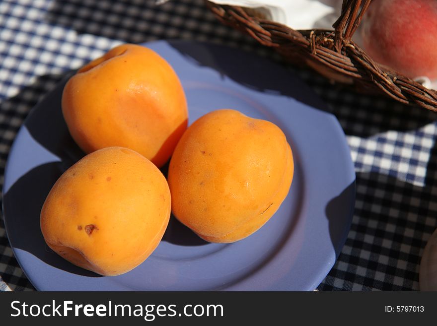 Breakfast table on sunny terrace, French Riviera, with apricots