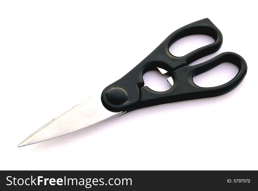 A photograph of kitchen scissors against a white background