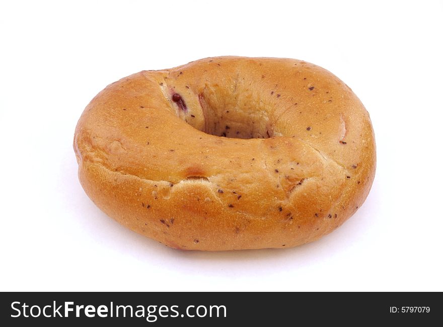 A photograph of a blueberry bagel against a white background