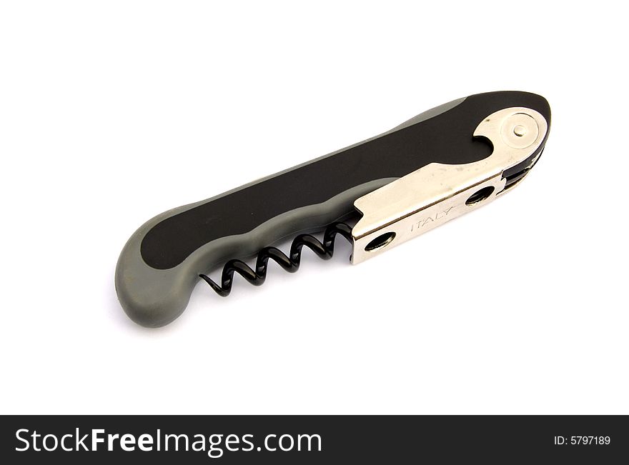 A photograph of a bottle opener against a white background