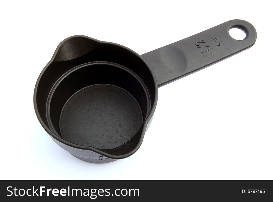 A photograph of a measuring cup against a white background