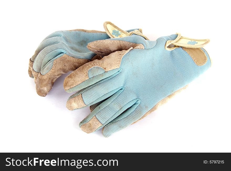 A photograph of work gloves against a white background