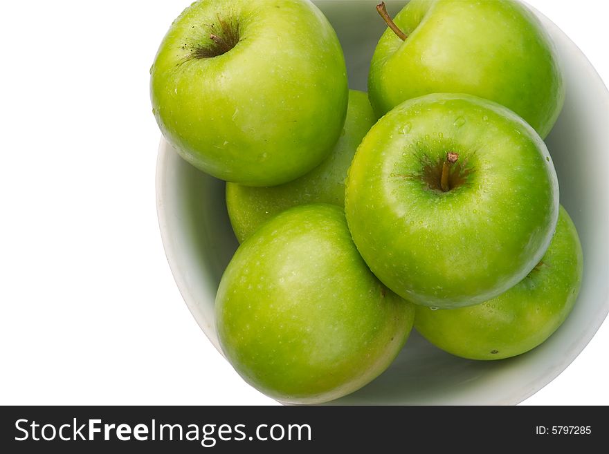 Close-up Of Granny Smith Apple In White Bowl