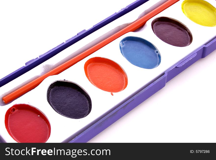 A photograph of a paint set against a white background. A photograph of a paint set against a white background