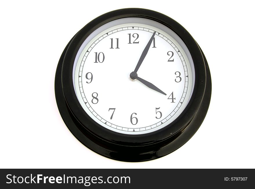 A photograph of a clock against a white background