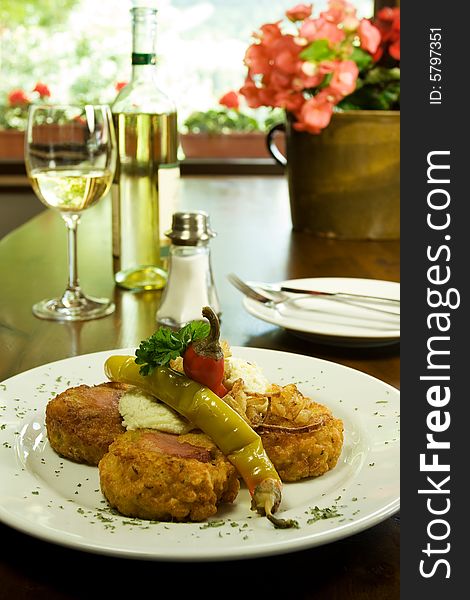 Fried Traditional Slovak sheep cheese with vegetables, wine in Slovak Traditional Restaurant. Fried Traditional Slovak sheep cheese with vegetables, wine in Slovak Traditional Restaurant