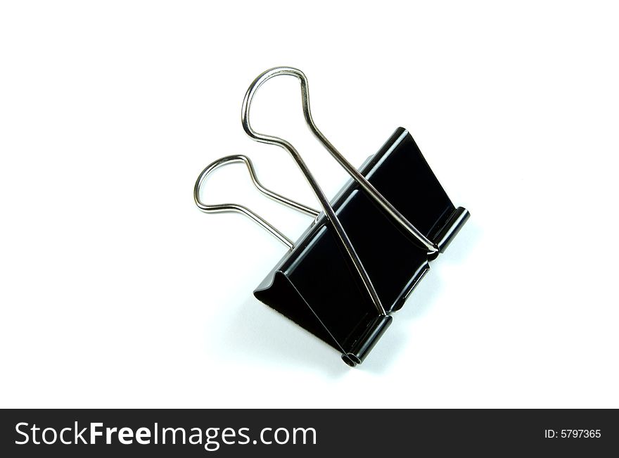 A photograph of a paper clamp against a white background