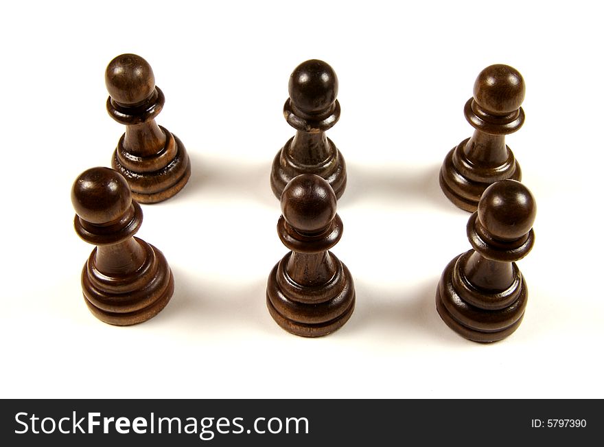 A photograph of pawns against a white background