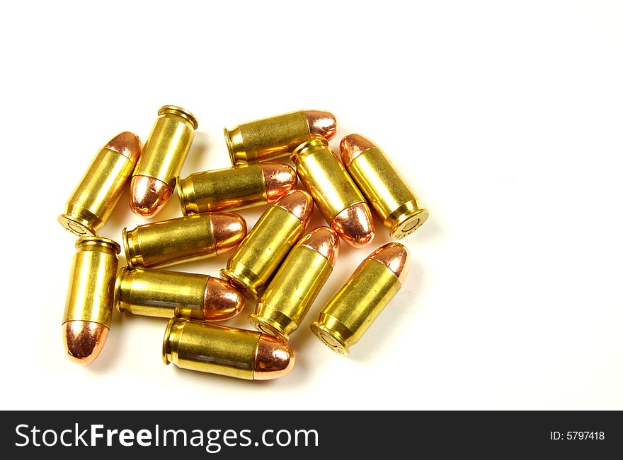 A photograph of dropped bullets against a white background