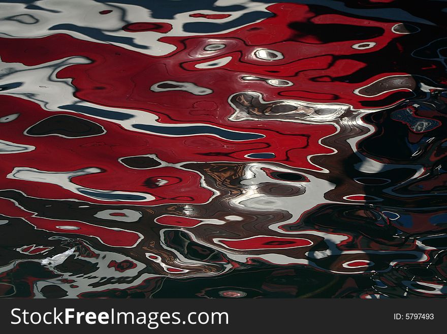 Seawater with reflections of a boat