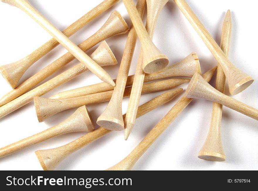 A photograph of golf tees against a white background