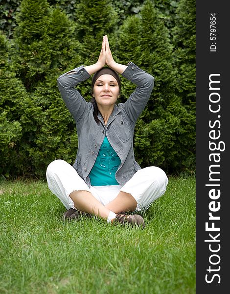 Happy woman relaxing on green grass. Happy woman relaxing on green grass