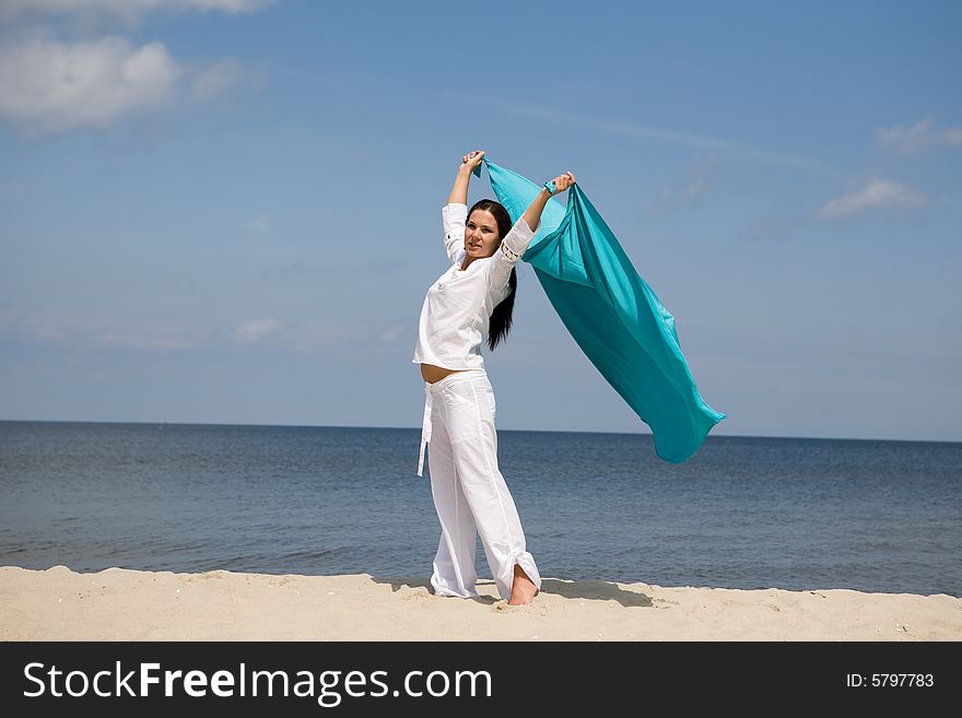 Attractive brunette woman relaxing on beach. Attractive brunette woman relaxing on beach